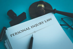 Personal-Injury-Lawyer-Harrisonburg-PA-gavel-with-paper-work-on-table.
