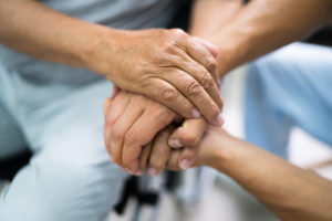 Nursing Home Abuse Lawyer - Elder Patient Helping Nurse Hand