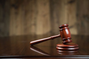 Legal Options After An Assault - gavel on legal table wood