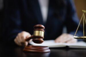 A lawyer banging a gavel on their desk. How long does a personal injury lawsuit take?